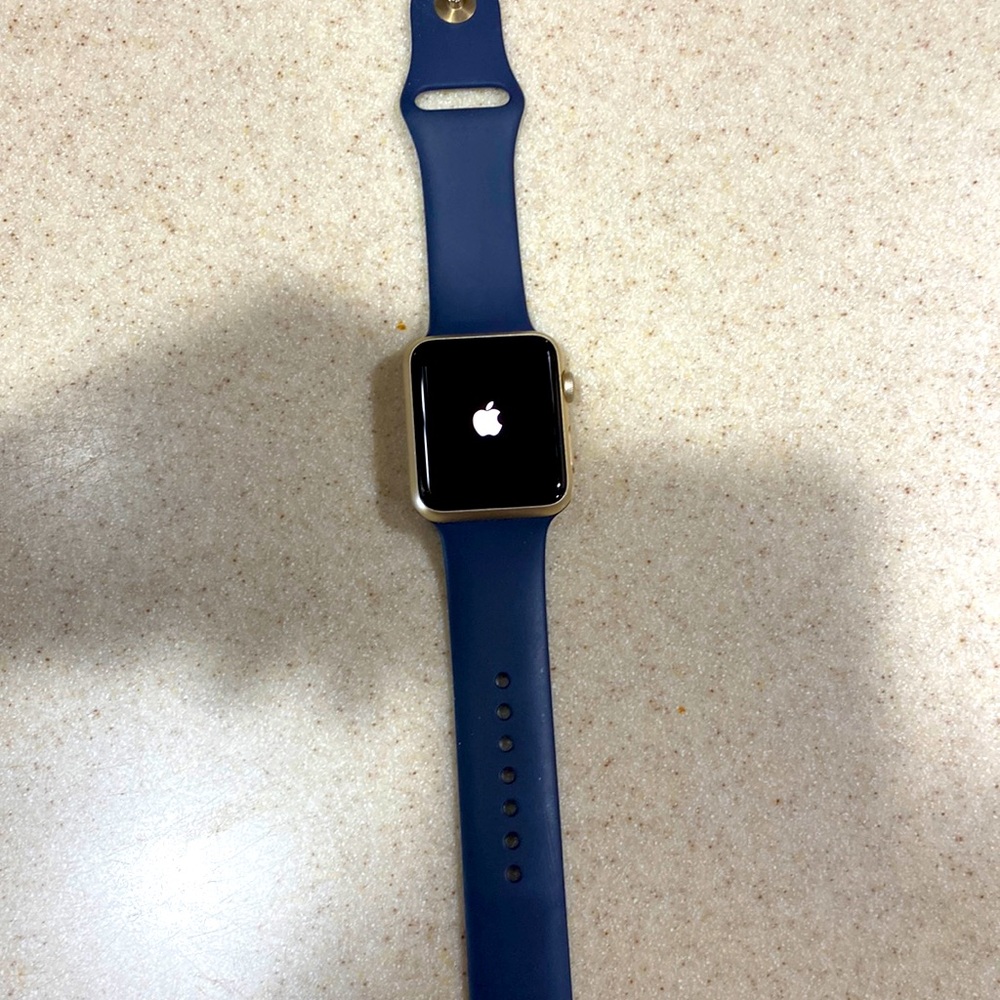 42MM Apple Watch with navy band and gold case